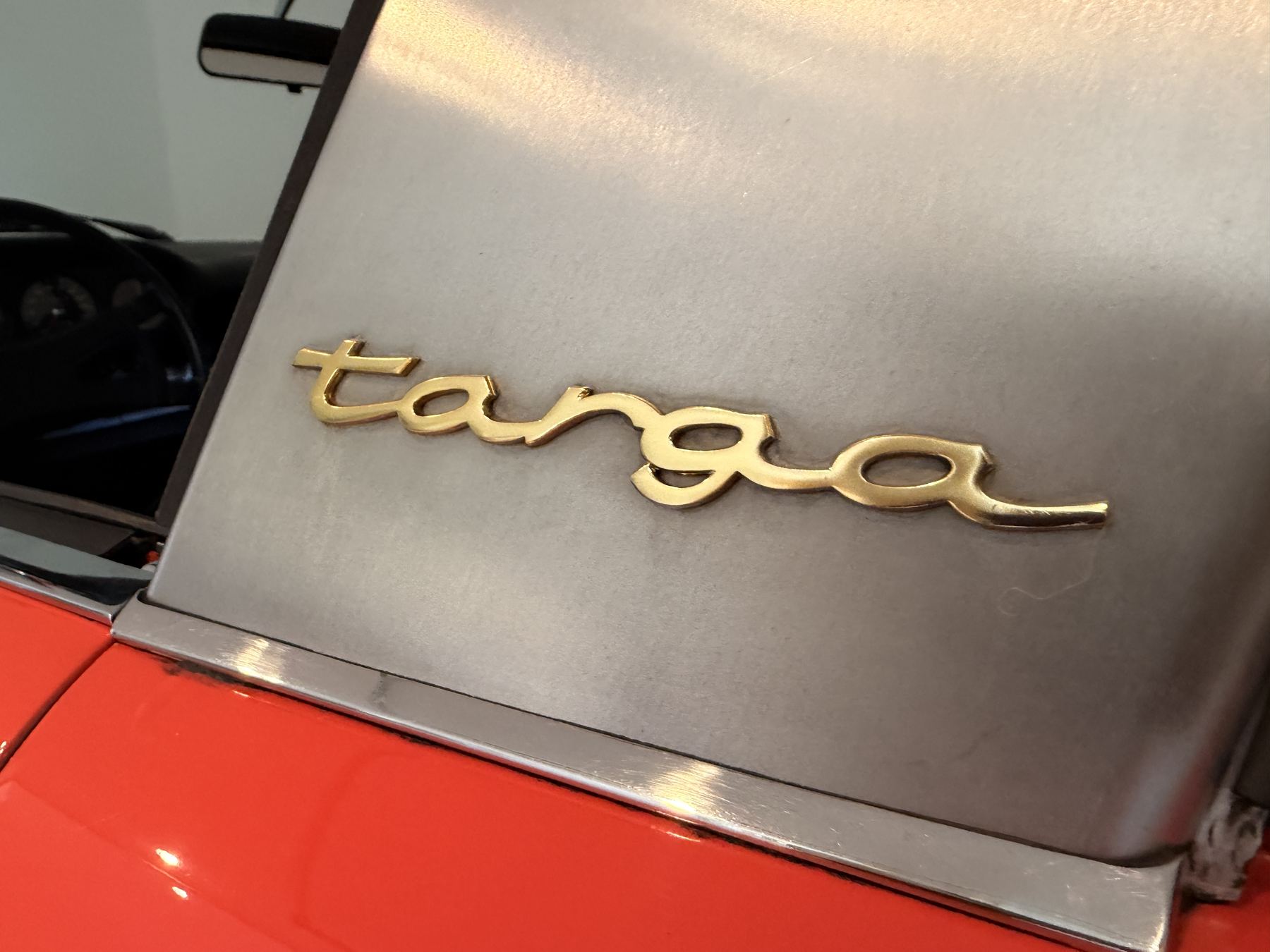 Gold targa script on the stainless roll bar